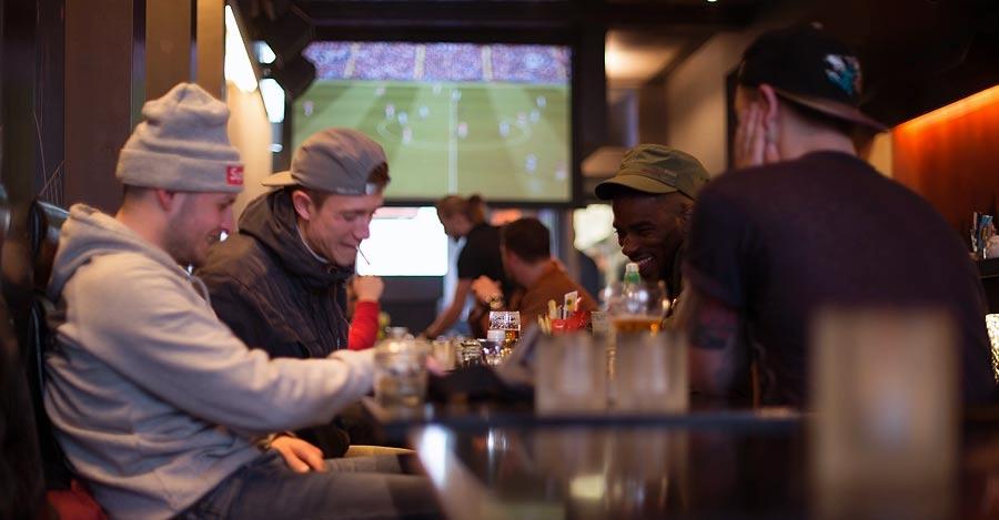 Guests relaxing together inside a Barney's venue
