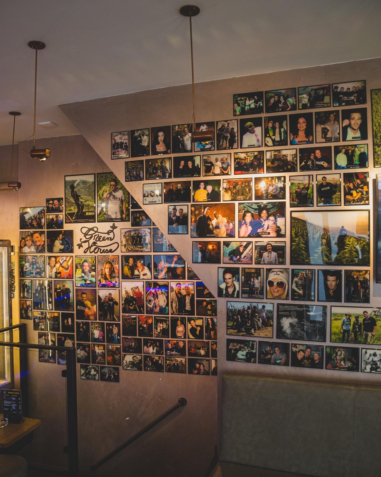 Green House Amsterdam interior photo wall documenting the brand's history and visitors