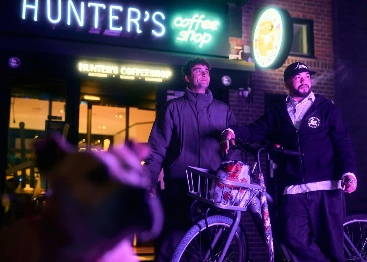 Hunter's coffeeshop exterior and illuminated signage at night