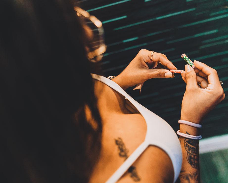 Customer preparing a joint at The Plug