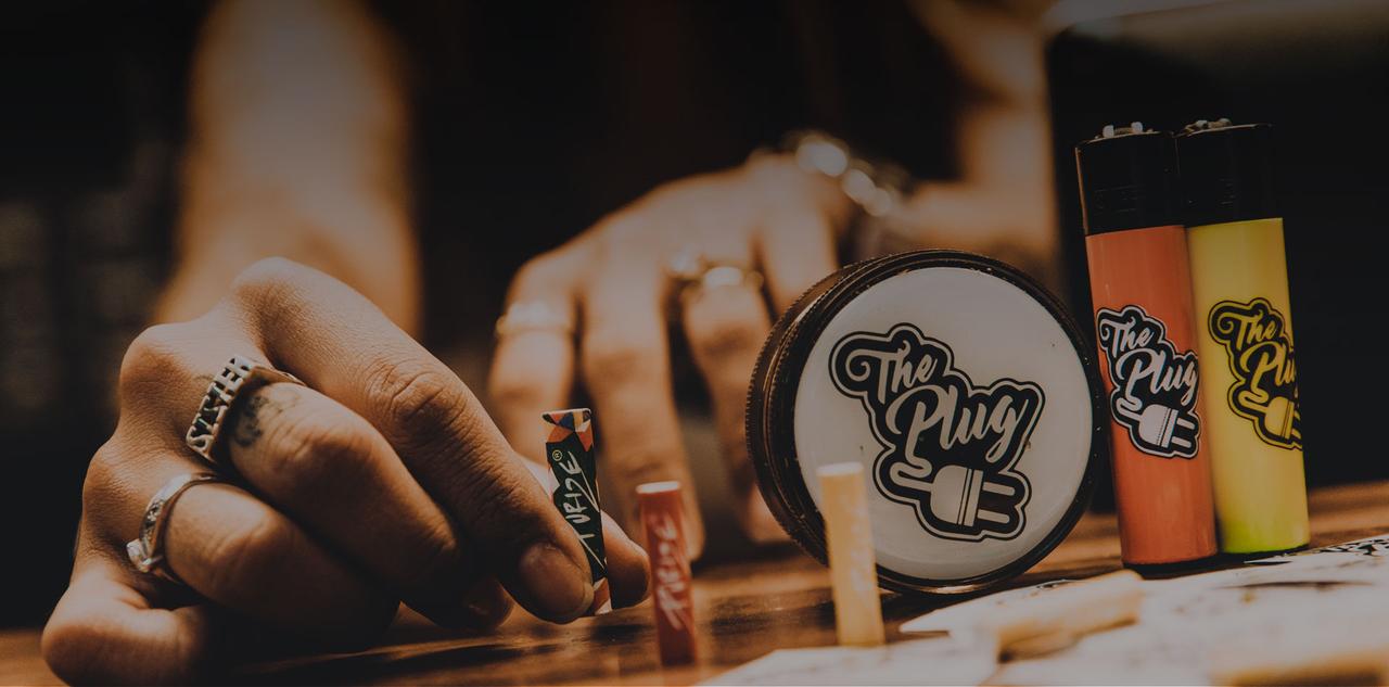 The Plug branded grinder, lighters and rolling accessories