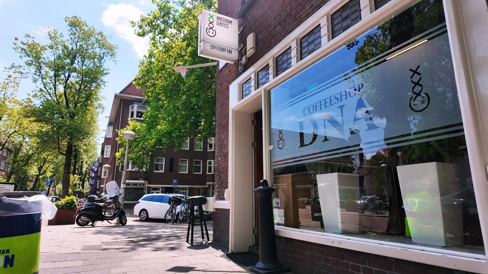Coffeeshop DNA storefront and Amsterdam Genetics signage in Amsterdam
