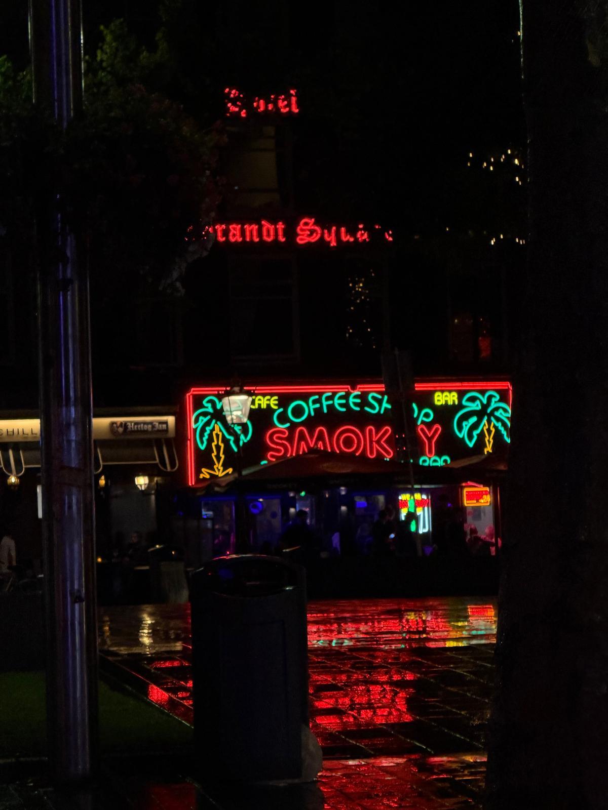 Night-time exterior of Coffeeshop Smokey on Rembrandtplein in Amsterdam