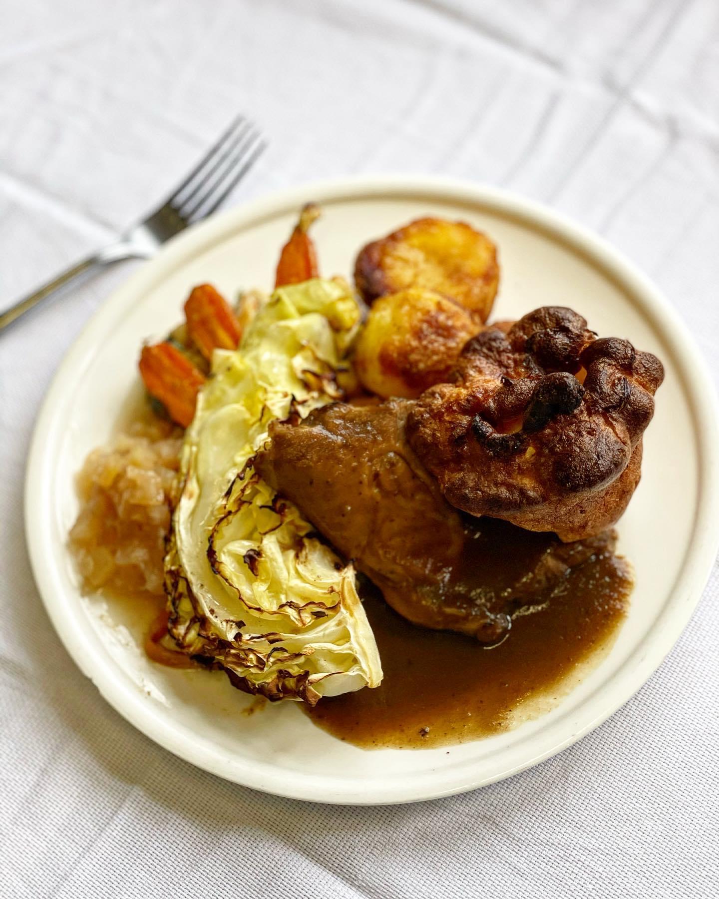 Sunday roast served at The Cottage with Yorkshire pudding and vegetables